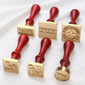 custom metal stamps with red wood handle